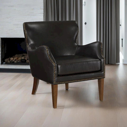 Fauteuil d'appoint dossier haut en similicuir marron, accoudoirs inclinés, une place